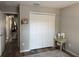 Bedroom with a large closet, vanity and wood flooring at 18 Larch Radl, Ocala, FL 34480