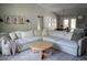 Bright living room boasts a large sectional sofa and modern decor at 18 Larch Radl, Ocala, FL 34480