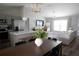 Open-concept floor plan with stainless steel appliances, kitchen island, and light-filled living area at 18 Larch Radl, Ocala, FL 34480