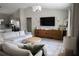Open concept living room features modern decor, ample seating, and hardwood floors at 18 Larch Radl, Ocala, FL 34480