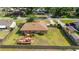 An overhead view shows the full fenced yard, back deck with pergola, out building, and surrounding neighborhood at 2045 Se 32Nd St, Ocala, FL 34471
