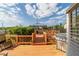 A large wooden deck leads to an outdoor entertainment area, with a grill in the foreground at 2045 Se 32Nd St, Ocala, FL 34471