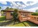 Backyard view of wooden deck with grill and access to the house at 2045 Se 32Nd St, Ocala, FL 34471
