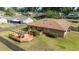 Aerial view of backyard deck, patio, and well-maintained lawn at 2045 Se 32Nd St, Ocala, FL 34471