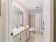 Bathroom with vanity sink, tiled bathtub and shower, and standard toilet at 2045 Se 32Nd St, Ocala, FL 34471