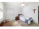 Cozy bedroom with neutral walls, and a bright window allowing natural light to filter through with a ceiling fan at 2045 Se 32Nd St, Ocala, FL 34471