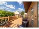 Wooden deck featuring an outdoor seating area and stainless steel grill at 2045 Se 32Nd St, Ocala, FL 34471