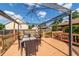 Relaxing outdoor deck with a dining table, chairs, and modern pergola at 2045 Se 32Nd St, Ocala, FL 34471