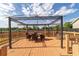 Outdoor wooden deck featuring a pergola and dining table at 2045 Se 32Nd St, Ocala, FL 34471