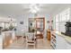 Open-concept dining area boasts tile flooring, natural light, and seamless flow to other spaces at 2045 Se 32Nd St, Ocala, FL 34471