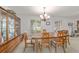 Bright dining room featuring a hardwood table, matching chairs and a decorative china cabinet at 2045 Se 32Nd St, Ocala, FL 34471