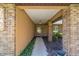 Inviting entrance with a well-lit porch, brick accents, and a charming welcome sign, framed by lush greenery at 2045 Se 32Nd St, Ocala, FL 34471