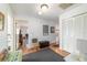 Hallway with access to multiple rooms, clean white walls, hardwood floors, and natural light streaming at 2045 Se 32Nd St, Ocala, FL 34471