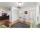 Hallway with views of laundry room and bathroom with a comfortable chair with a view of the living room at 2045 Se 32Nd St, Ocala, FL 34471