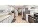 Spacious kitchen with stainless steel appliances and tile floor, and easy access to dining area at 2045 Se 32Nd St, Ocala, FL 34471