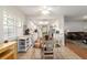 Bright open-concept kitchen and dining area with modern appliances and ample cabinet space at 2045 Se 32Nd St, Ocala, FL 34471