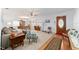 Inviting living room features wood floors, neutral colors, and a decorative front door at 2045 Se 32Nd St, Ocala, FL 34471