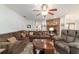 Comfortable living room with hardwood floors, a cozy brick fireplace, and plenty of seating options at 2045 Se 32Nd St, Ocala, FL 34471