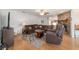 Comfortable living room with hardwood floors and a charming brick fireplace as its focal point at 2045 Se 32Nd St, Ocala, FL 34471