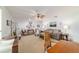 Comfortable living room with neutral colors, ceiling fan, and ample seating arrangements at 2045 Se 32Nd St, Ocala, FL 34471