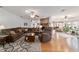 Spacious living room with hardwood floors, a brick fireplace, and lots of comfortable seating at 2045 Se 32Nd St, Ocala, FL 34471