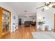 Spacious living area with an open layout, featuring wood flooring and lots of natural light at 2045 Se 32Nd St, Ocala, FL 34471
