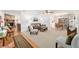 Bright and airy living room featuring a fireplace, comfortable seating, and an adjacent dining area for seamless entertaining at 2045 Se 32Nd St, Ocala, FL 34471