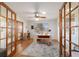 Bright home office featuring a desk, ceiling fan, and wood-look flooring at 2045 Se 32Nd St, Ocala, FL 34471