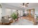 Sunroom featuring natural lighting from the windows and French doors at 2045 Se 32Nd St, Ocala, FL 34471