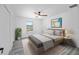 Cozy bedroom with neutral decor, a large window, and stylish furnishings at 24375 Nw Foxglove Ln, Dunnellon, FL 34431