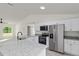 Bright kitchen features stainless steel appliances, granite counters, and ample space at 24375 Nw Foxglove Ln, Dunnellon, FL 34431