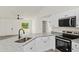 Kitchen featuring stainless steel appliances, granite counters, and an open floor plan at 24375 Nw Foxglove Ln, Dunnellon, FL 34431