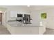 Bright kitchen with granite countertops, stainless steel appliances, and white cabinets at 24375 Nw Foxglove Ln, Dunnellon, FL 34431
