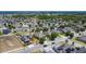 Overhead shot of a residential community showcasing well-kept properties with mature trees and landscaped yards at 4013 Ruby Run, Haines City, FL 33844