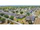 Scenic aerial shot showcasing the backyard of several homes with fencing and green spaces in a suburban neighborhood at 4013 Ruby Run, Haines City, FL 33844
