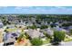 Aerial panorama of a residential area displaying neat streets, green spaces, and various roof types at 4013 Ruby Run, Haines City, FL 33844