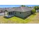 An aerial shot of a home's exterior with a backyard and covered patio at 4013 Ruby Run, Haines City, FL 33844