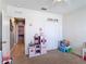 Bedroom featuring carpeted floors, ceiling fan, and toys at 4013 Ruby Run, Haines City, FL 33844