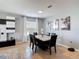 Contemporary dining area featuring a marble table with black chairs and neutral decor at 4013 Ruby Run, Haines City, FL 33844