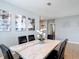 Stylish dining table with marble top and upholstered chairs, complemented by modern artwork at 4013 Ruby Run, Haines City, FL 33844