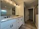 Updated bathroom features double sinks, granite countertops and a walk-in shower at 4424 Sw Viola Ct, Dunnellon, FL 34431