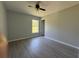 Inviting bedroom with vinyl plank flooring, neutral walls, a ceiling fan, and a window providing natural light at 4424 Sw Viola Ct, Dunnellon, FL 34431