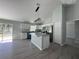 Modern kitchen featuring stainless steel appliances, granite countertops, and ample cabinet space at 4424 Sw Viola Ct, Dunnellon, FL 34431