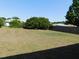 Large backyard featuring a wooden fence and mature tree providing shade and privacy at 4677 Nw 46Th Ave, Ocala, FL 34482
