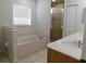 Bright bathroom boasts a large tub, walk-in shower, and dual sinks set in a well lit spacious area at 4677 Nw 46Th Ave, Ocala, FL 34482