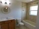 Cozy bathroom featuring a vanity, mirror, toilet and a shower-tub combo at 4677 Nw 46Th Ave, Ocala, FL 34482