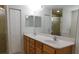 Spacious bathroom features double sinks and ample storage space, with a separate shower stall and linen closet at 4677 Nw 46Th Ave, Ocala, FL 34482