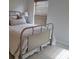 Serene bedroom with a comfortable bed, neutral bedding, and natural light through window blinds at 4677 Nw 46Th Ave, Ocala, FL 34482