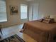 Bedroom featuring tile floors, neutral walls and a comfortable bed at 4677 Nw 46Th Ave, Ocala, FL 34482