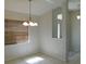 An ample dining area bathed in light from a window, creating a cozy and inviting space for gatherings at 4677 Nw 46Th Ave, Ocala, FL 34482